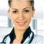 Smiling female doctor in a white coat with a stethoscope.